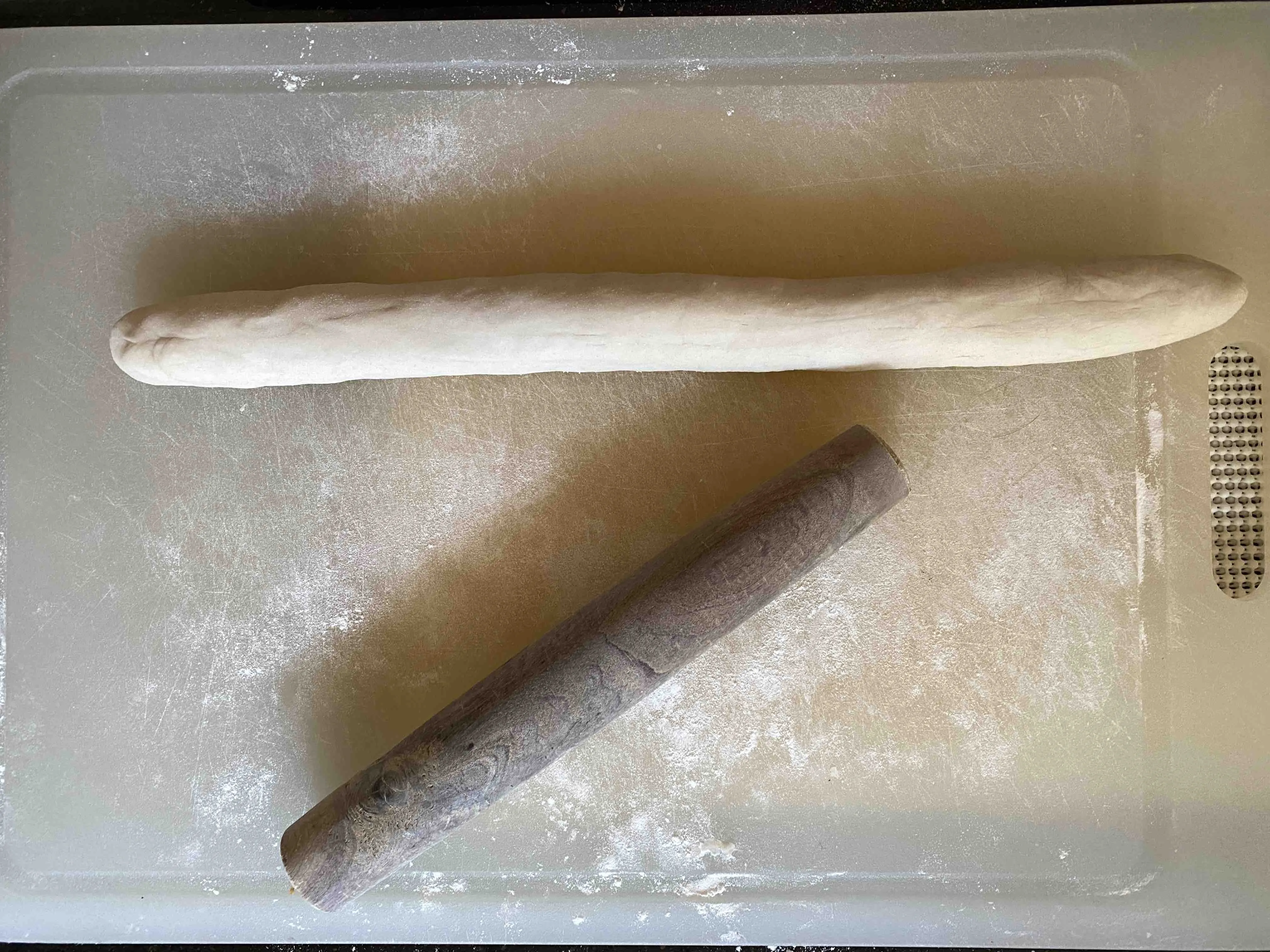 Cut dough pieces pressed into wrappers.